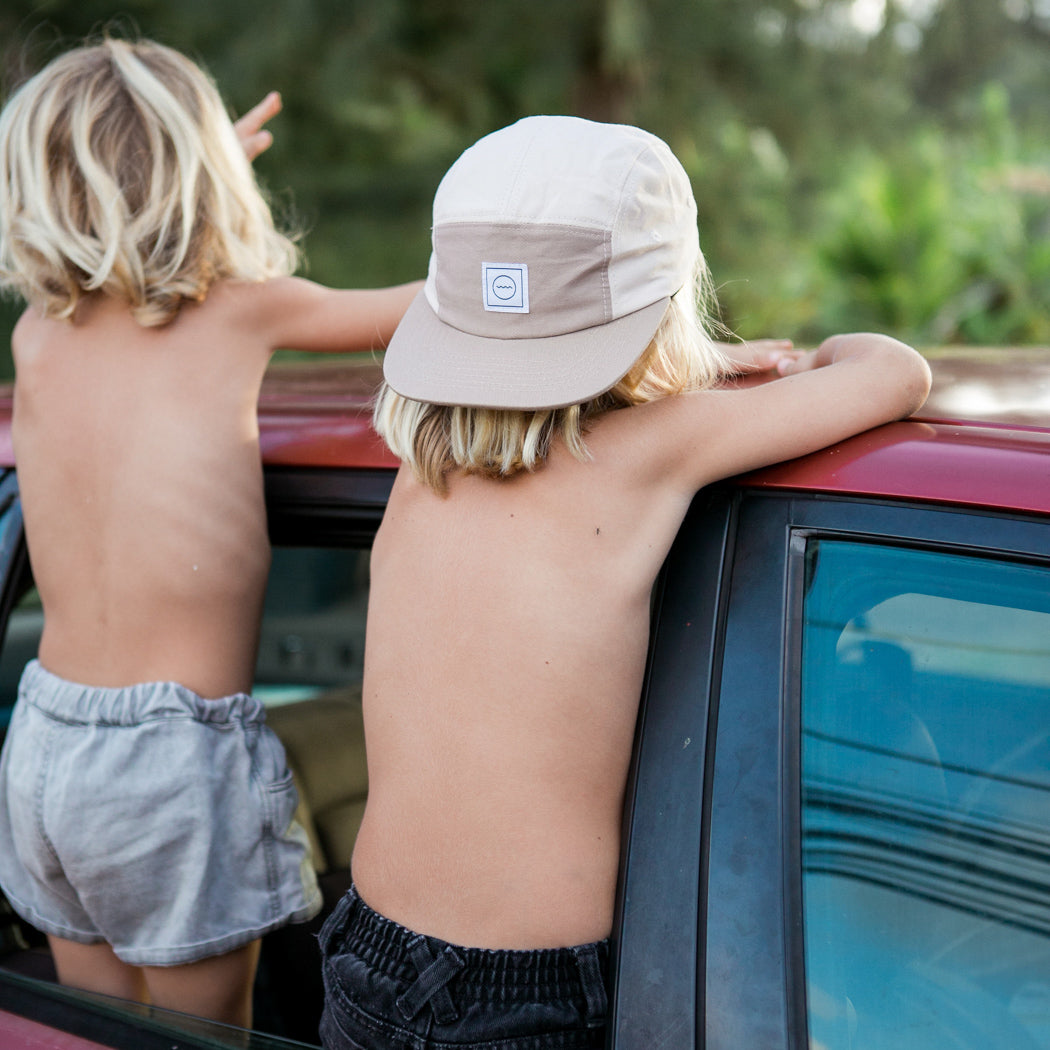 kid modeling the Sand Five-Panel Hat