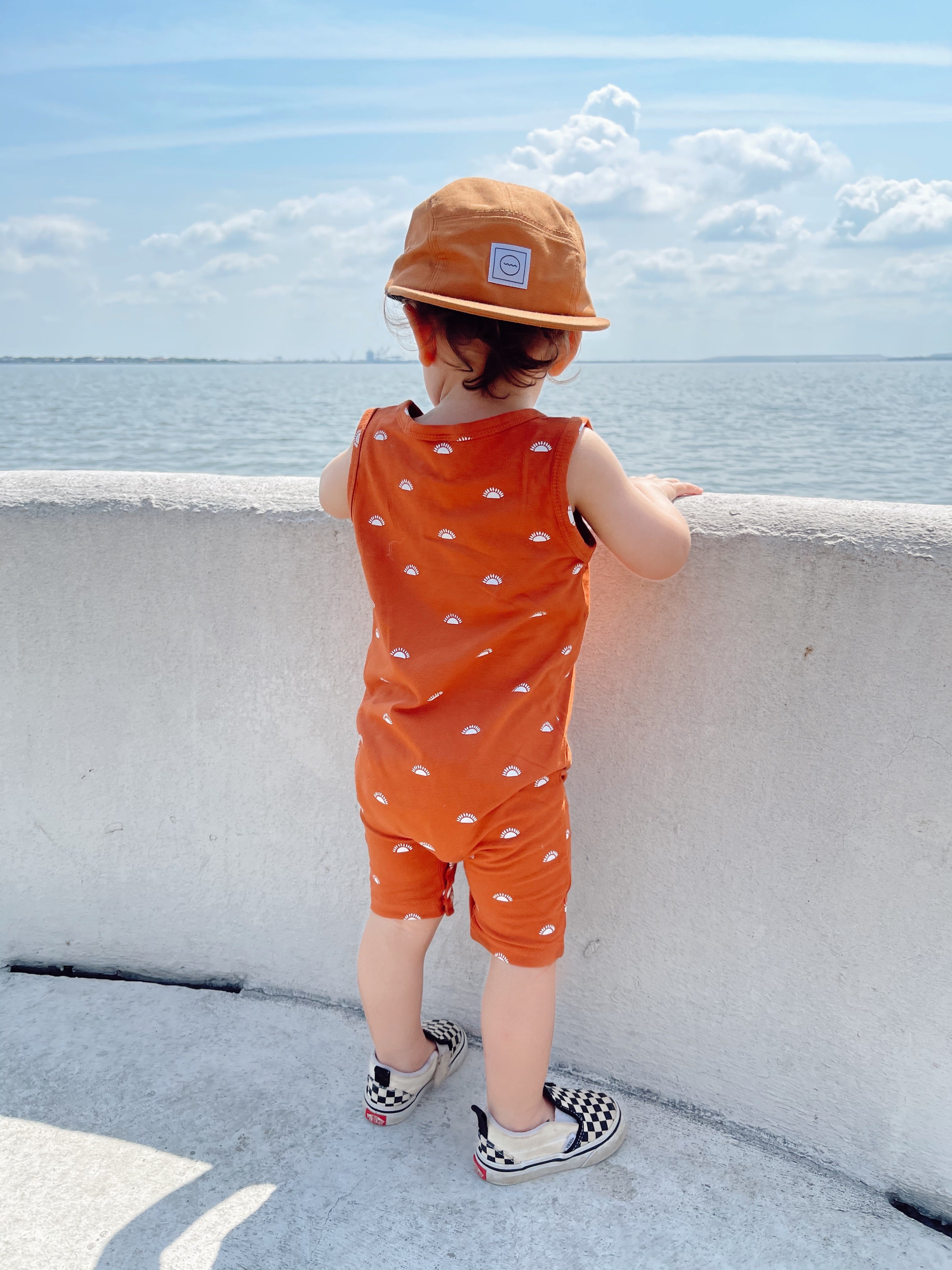 Roman modeling the Harvest Five-Panel Hat