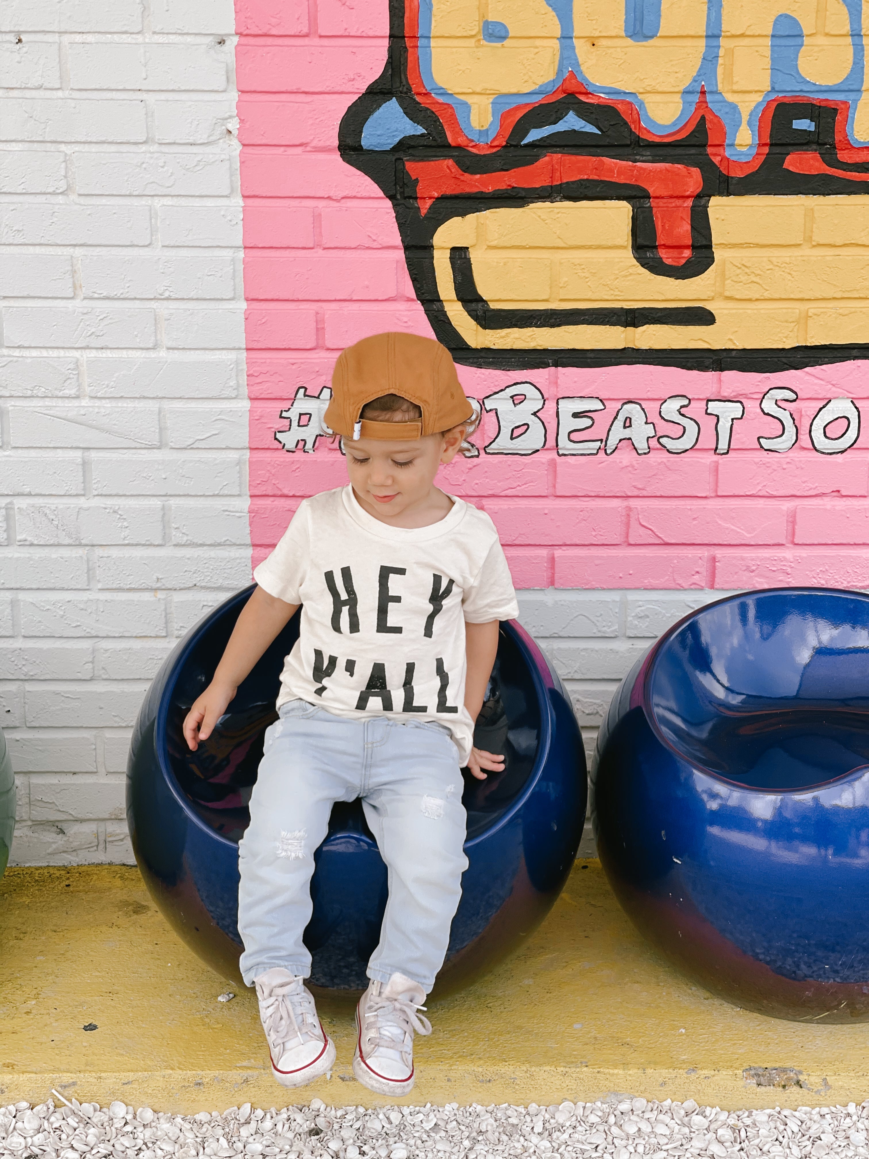 Roman modeling the Hey Y’All Organic Kids Tee