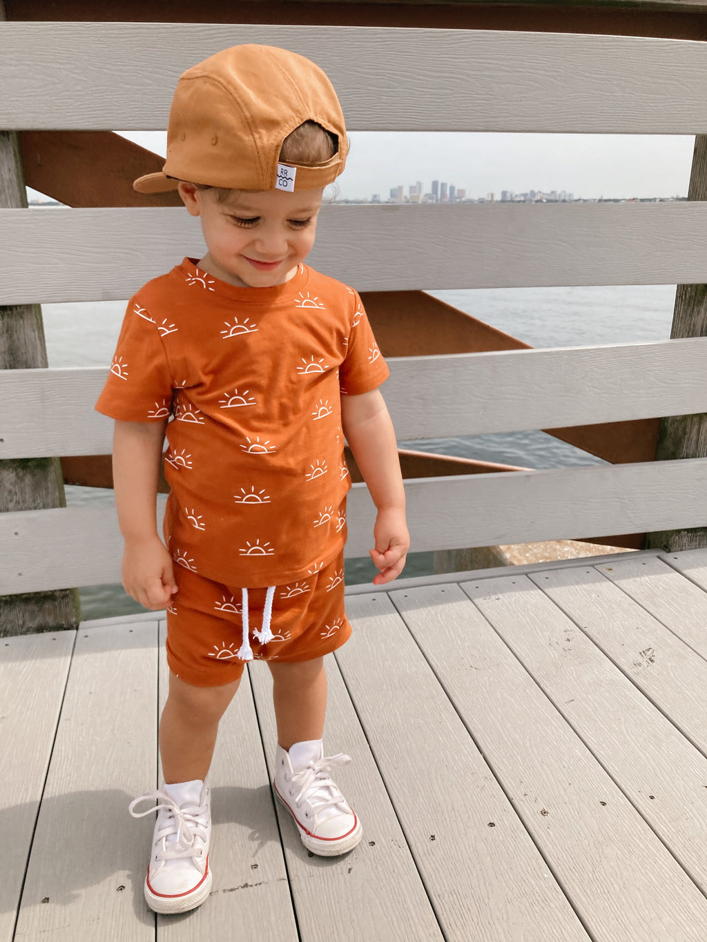 Toddler modeling the Terracotta Sunrise Two-Piece Set