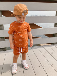 Toddler modeling the Terracotta Sunrise Two-Piece Set
